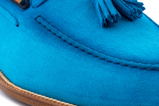 Mocassino in suede con pon pon